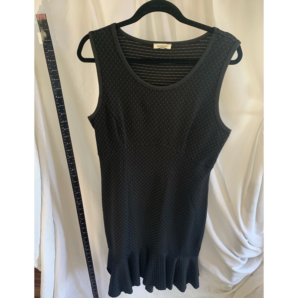 Really cute dress. Fits nice, slight flare at hem is flattering. Stretchy